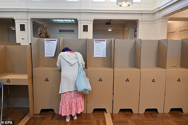 A voter is seen inside a polling station at Old Parliament House in Canberra