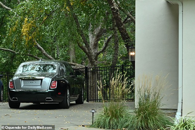 The Chiefs tight end's Rolls Royce is parked in the driveway of the luxury home