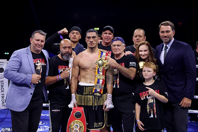 OpetOpetaia (centre) poses with his belt, team and Eddie Hearn after the IBF World Cruiserweight Title fight against Jordan Thompson at OVO Arena Wembley