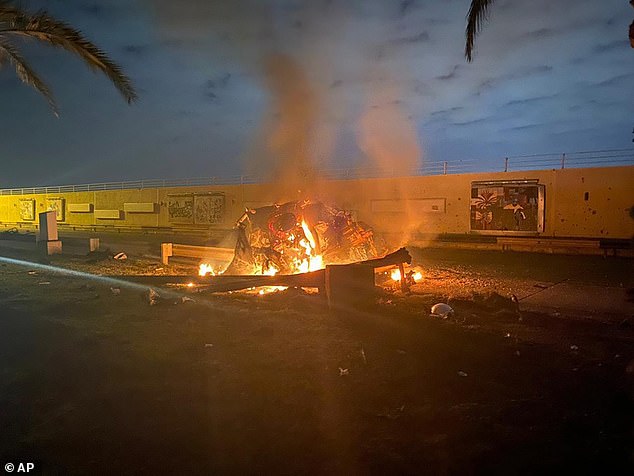 Soleimani's convoy is pictured burning near Baghdad airport in January 2020 after the fatal US drone strike