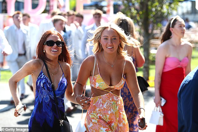 A bold new trend has taken to the field, with many women showing up in cut-out dresses as the mercury hit a warm 32C in Sydney on Saturday.