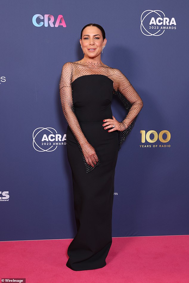 Kate Richie kept things classy in a black nightgown with sheer detailing over the shoulder