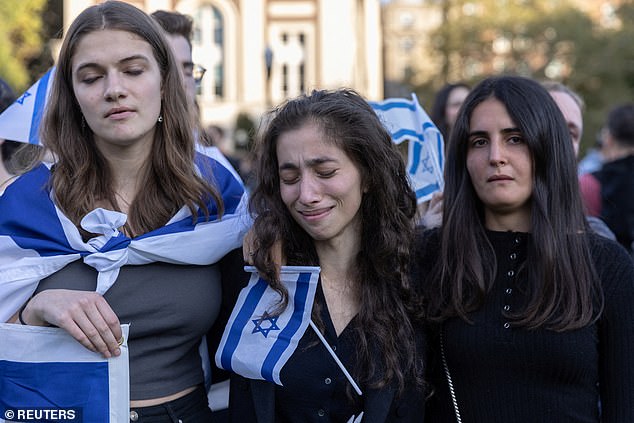 Three female pro-Israel Columbia University students look solemn as they participate in a protest amid the ongoing conflict in Gaza