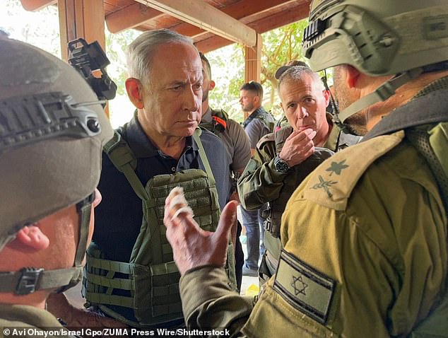 Israeli Prime Minister Benjamin Netanyahu met with soldiers on the border with Gaza earlier Saturday ahead of an expected ground attack by Israeli forces