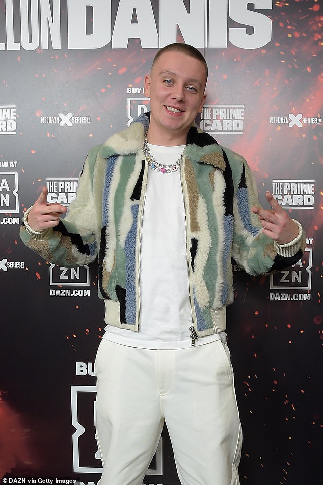 One-of-a-kind sense of style: Rapper Aitch wore a multi-coloured fleece for the night with a matching white T-shirt and trousers