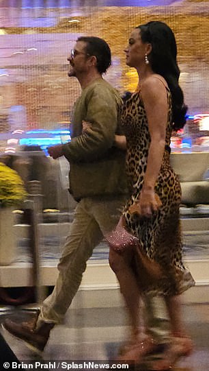 Cute: Katy and the 46-year-old Australian actor were cute as they walked hand-in-hand through the Aria Hotel