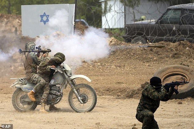 Hezbollah fighters pictured during an exercise in May have long trained for war against Israel