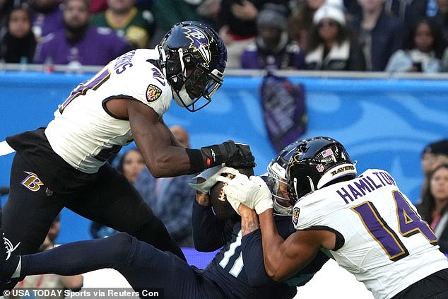 Hamilton was thrown out for a hit against Titans catcher Chris Moore (center).