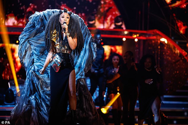 Majestic: The iconic singer looked regal as she performed from a blue velvet throne