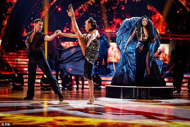 Warm-up: The iconic singer looked regal as she performed from a blue velvet throne as images of flames blazed around the dancers for a dazzling performance