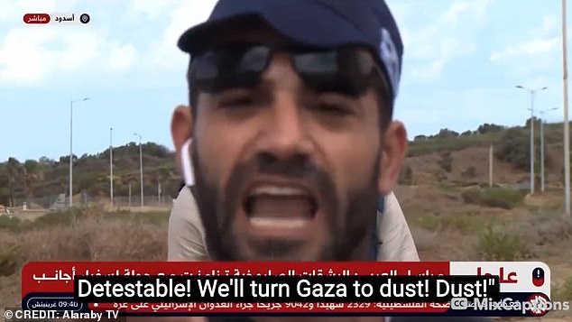 He then turns to the camera before shouting that Israel will 'turn Gaza into dust'