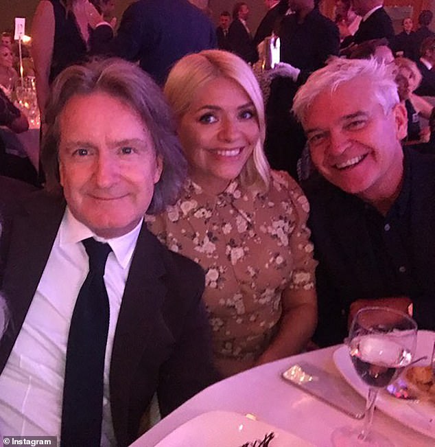 Surprise: Martin Frizzell (left) was left blindsided by his star host's shock announcement - which left some staff at the ITV show breaking down in tears (pictured with Holly and Philip Schofield)