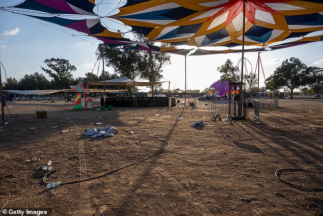 Destroyed cars and personal belongings are still strewn across the grounds of the Supernova Music Festival