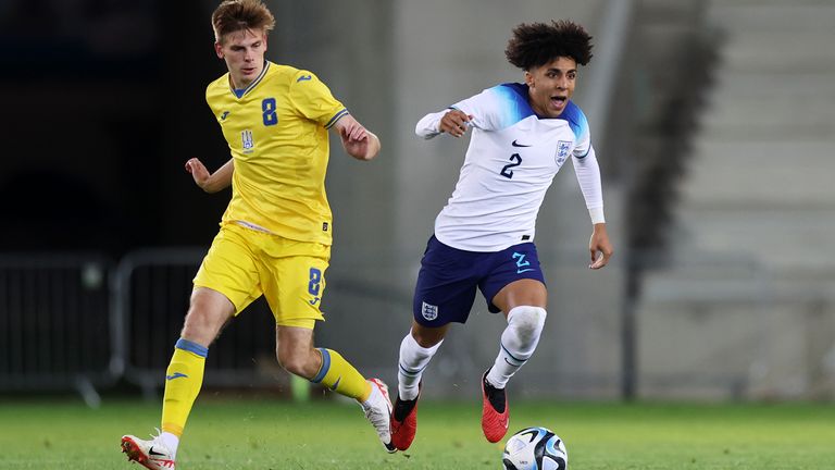 Rico Lewis of Manchester City takes the ball for England from Oleh Ocheretko of Ukraine