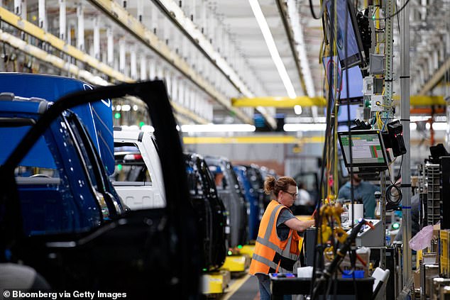 A worker on the Ford F-150 Lightning production line at the Ford Rouge Electric Vehicle Center in Dearborn, Michigan