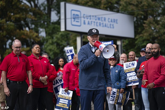 President Joe Biden speaks with striking United Auto Workers on the picket line outside the Willow Run Redistribution Center in Van Buren Township, Michigan