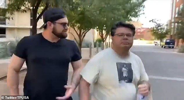 Professor David Boyles, right, was repeatedly asked about his involvement in starting a local chapter of Drag Queen Story Hour in Arizona