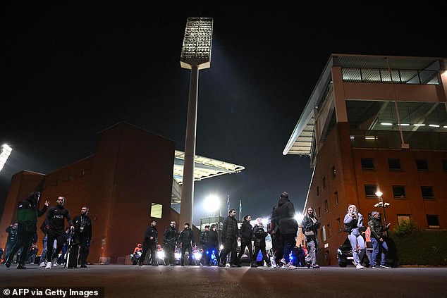 Belgian police surrounded the stadium as shocked fans made their way home