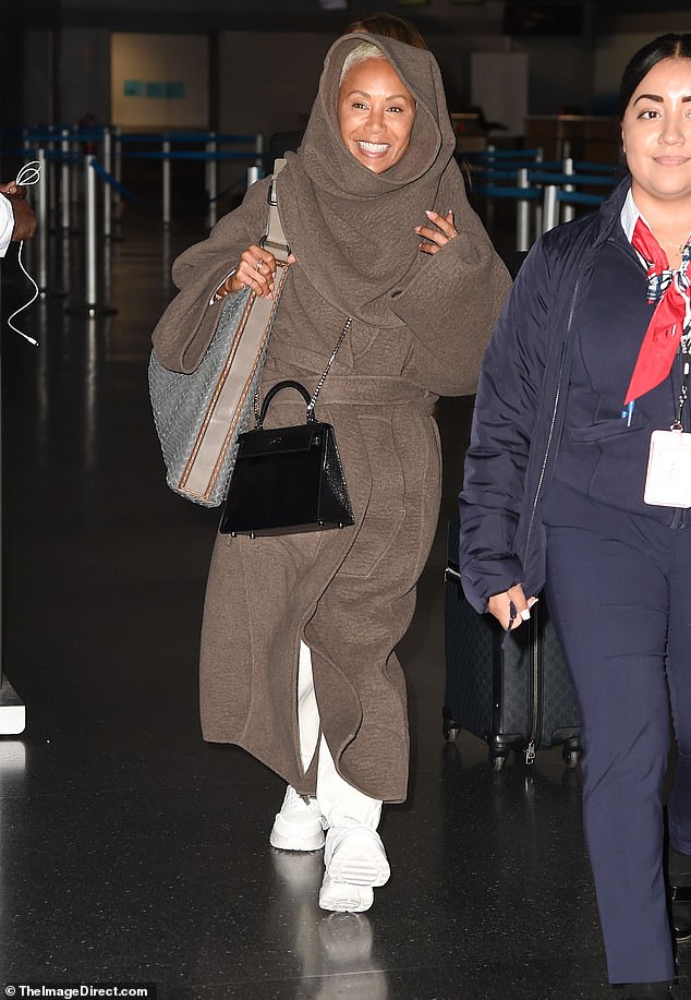 Self-love: The toned actress stripped down for her flight to New York City but still flashed a bright smile to onlookers