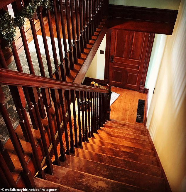 The stairs in the family home lead to two bedrooms on the top floor