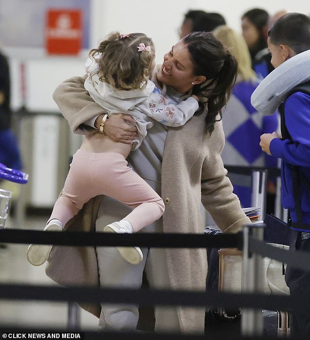 Exciting: Olivia was a bundle of energy as the family made their way around Heathrow to catch their flight