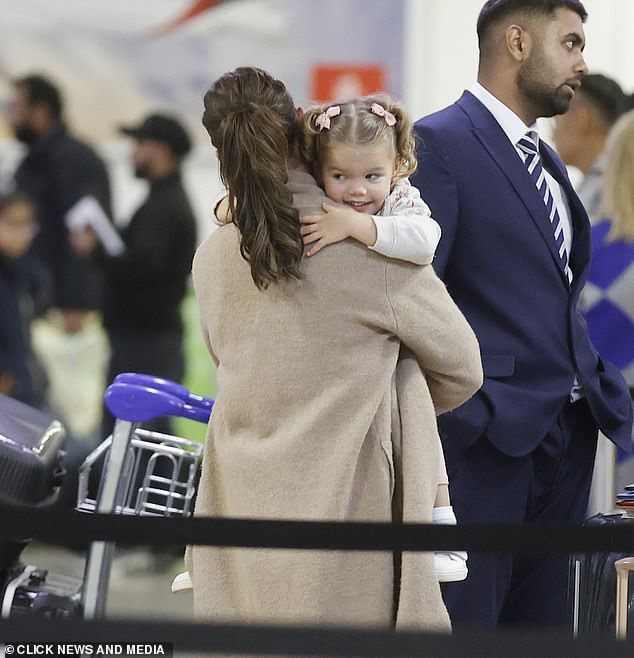 Getaway: The family looked excited to head off on their vacation