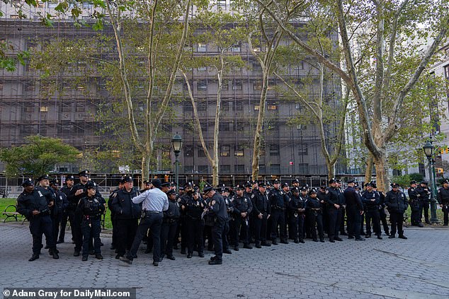 NYPD officers are briefed near the Manhattan Supreme Court ahead of former President Donald Trump's appearance in Manhattan on Tuesday