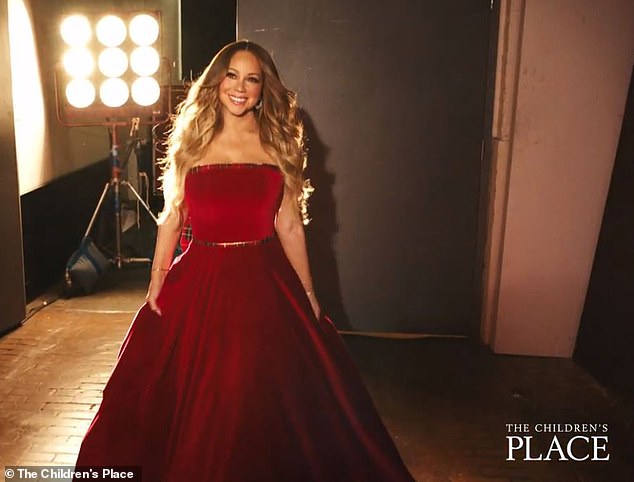 The singer continues to cement her status as the Queen of Christmas by starring in a commercial