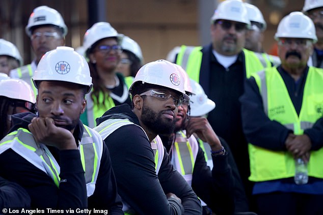 Norman Powell (left) and Paul George (center) are pictured constructing the Intuit Dome