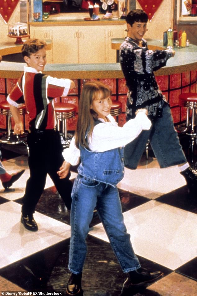 The singer, pictured center, started her career in 1989 with The All-New Mickey Mouse Club, alongside Justin (pictured left), Ryan Gosling and Christina Aguilera.