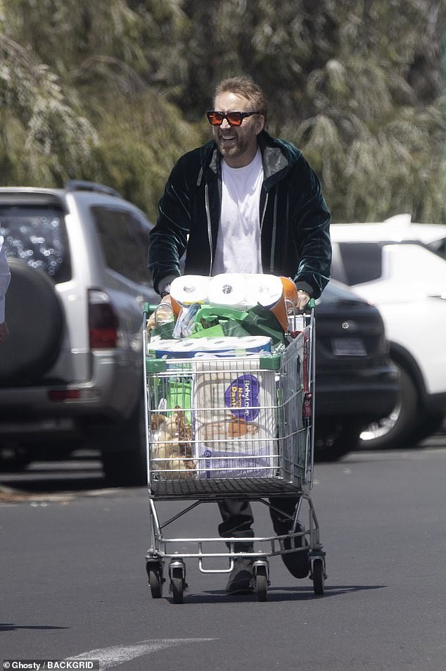 He later went to the local Woolworths supermarket after telling the owners of the Asian store that he needed oil and butter, and they advised him to go to 'the Woolies'.  Pictured with a cart full of goods after a visit to Woolworths