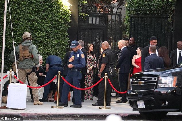 Dressed-up guests could be seen outside the reception venue where they celebrated