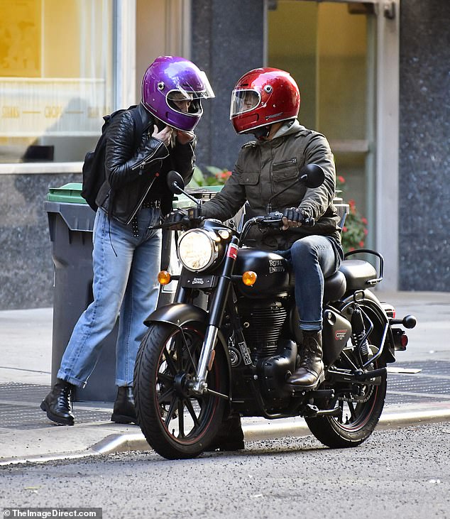 She tucked her hair into the helmet and made sure her belt was secured