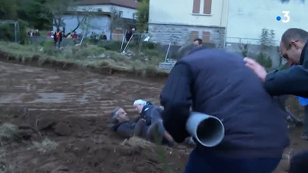 The scuffle with the nun forces the protester to release the cylinders in his hands, as he throws them aside, and tries to break away from the heroic sister.