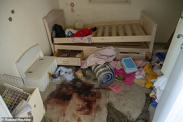 Another pool of blood lies in the nearby room, adjacent to a child's wooden bed.  It appears 'happy, friendly' 13-year-old Yahel was fatally injured in circumstances too harrowing to imagine