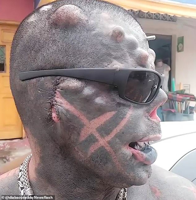 His ears, nose, nipples and the ring finger of his left hand have been removed, and more than 80 percent of his body has been inked, including his eyeballs.