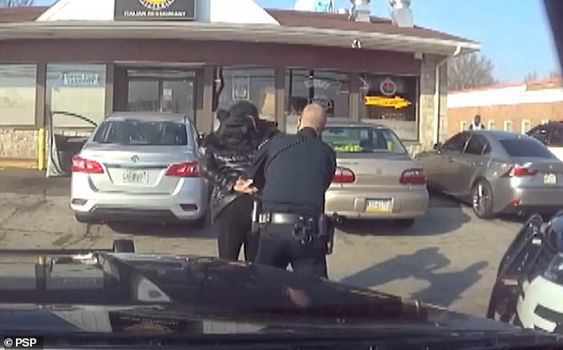 Hertz agreed to pay $168 million to settle claims from irate car rental companies accused of stealing their vehicles.  Pictured: Customer Saleema Lovelace is wrongfully arrested outside a store in Pennsylvania