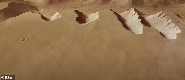 Experts combined images from Mars Express to create an animation showing the 745-mile (1,200 km) maze of canyons that are 18.6 miles (30 km) wide and 3.7 miles (6 km) deep.