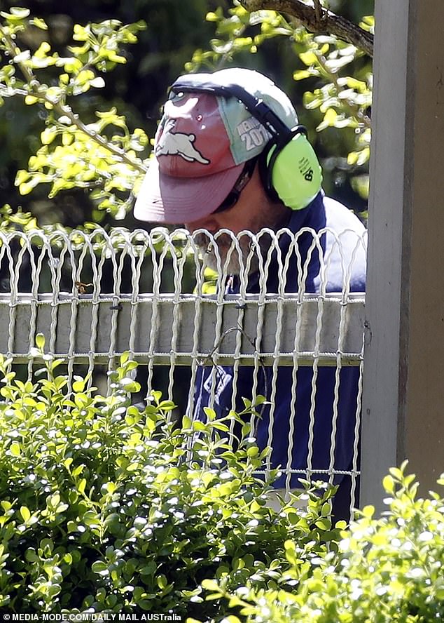 The radio star was spotted pruning the hedges on the property he owns in the Dandenong Ranges