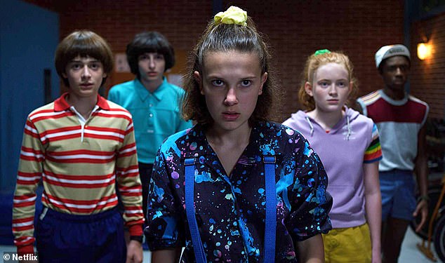 Millie pictured with her co-stars Noah Schnapp, Finn Wolfhard, Sadie Sink and Caleb McLaughlin in a scene from season two of Stranger Things