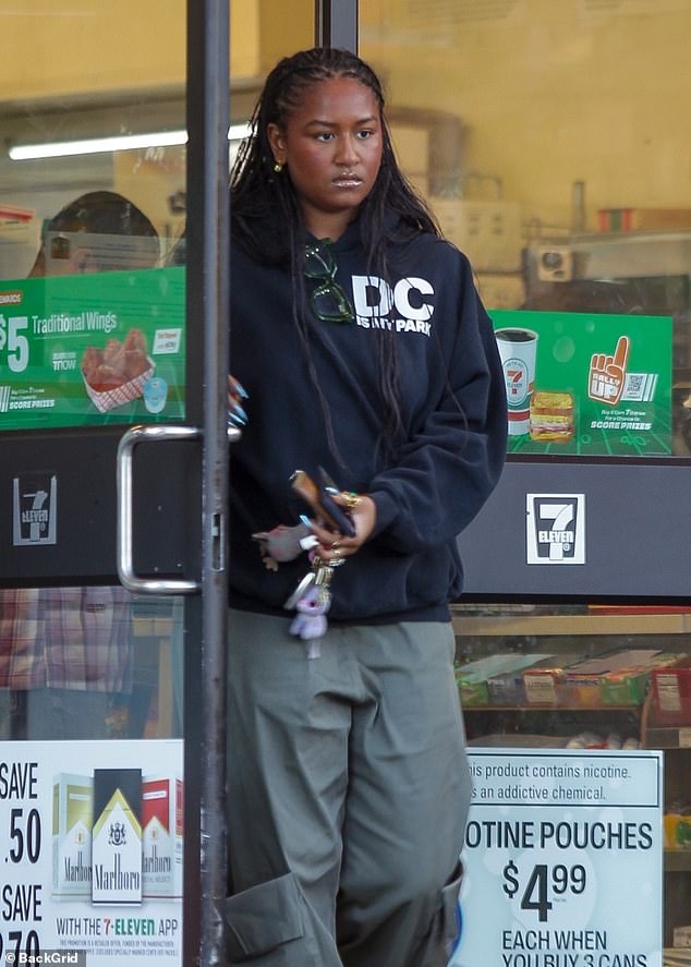 The University of Southern California graduate was dressed casually in a black hooded sweatshirt and baggy cargo pants