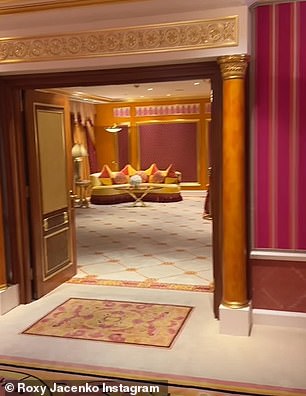 Moments later, she took a stroll through the suite's ornate living area, which is decorated with lavish curtains, cushions and patterned carpets, with huge mirrors, decorative pillars and marble tiles.