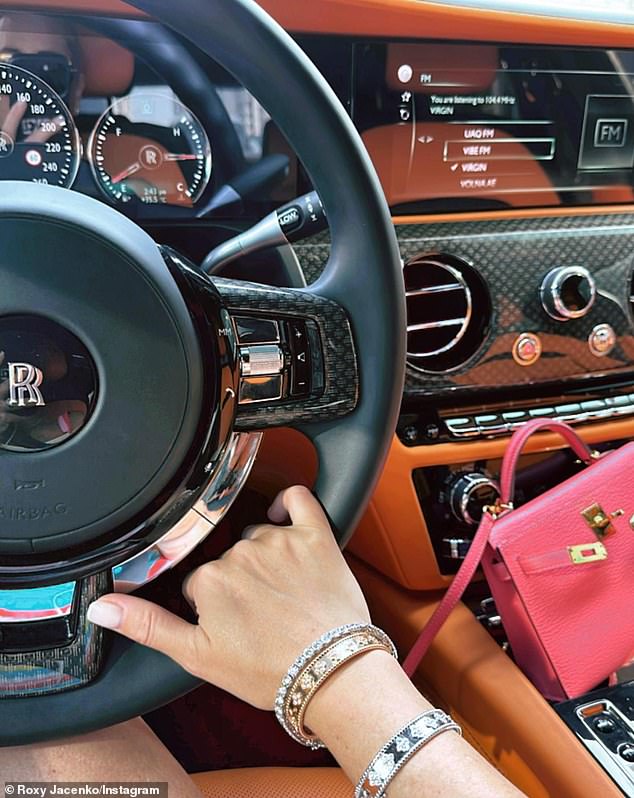 Roxy proved that she certainly enjoys the finer things in life as she sits behind the wheel of a Rolls Royce while clutching a pink mini Kelly Hermes handbag.  Pictured