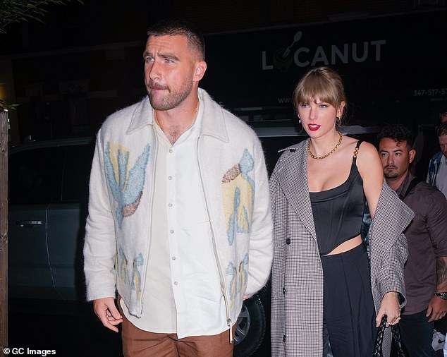 Getting frisky: Reacting to images of the new couple arriving at the SNL after-party on Saturday, eagle-eyed Swifties were quick to point out that the 33-year-old pop star's signature red lipstick, which is usually perfectly lined, was noticeably smudged