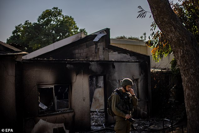 At some point during the 14 hours that Golan was on watch, he saw that his neighbor's house had also been set on fire (similar to the house in the photo above) and warned them to get away;  they managed to escape to another neighbor's safe room