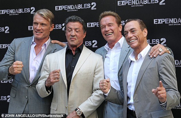 Hardworking people: The actor said he still makes two films a year and said he is much braver than Arnold Schwarzenegger (second from right) and Sly Stallone (second from left) when it comes to taking on work because he claims they are afraid of travel