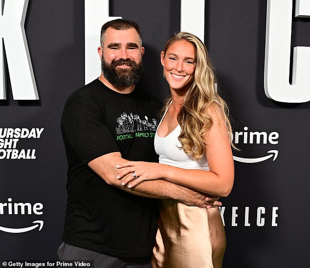 Jason Kelce said he likes to sit along the wall when he's out and about with his wife Kylie (right)