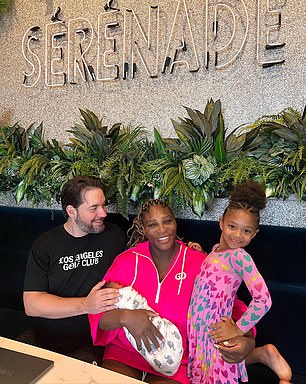 Serena poses with her husband Alexis and two daughters Olympia and Adira