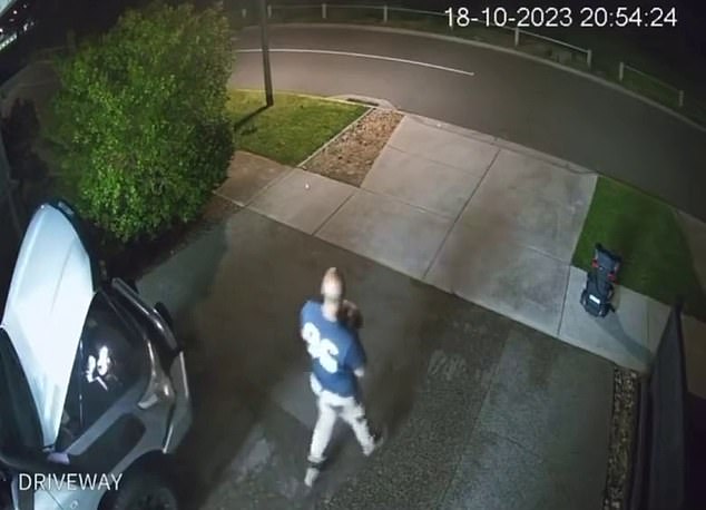 Surveillance footage from the home shows a man in his driveway startled by the loud bang