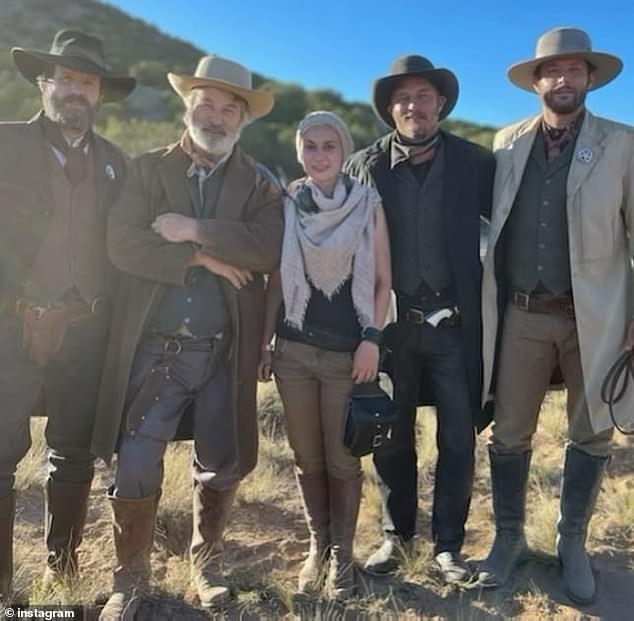 Baldwin with Hutchins (center) and other members of the film's cast on set in Santa Fe while shooting the movie Rust